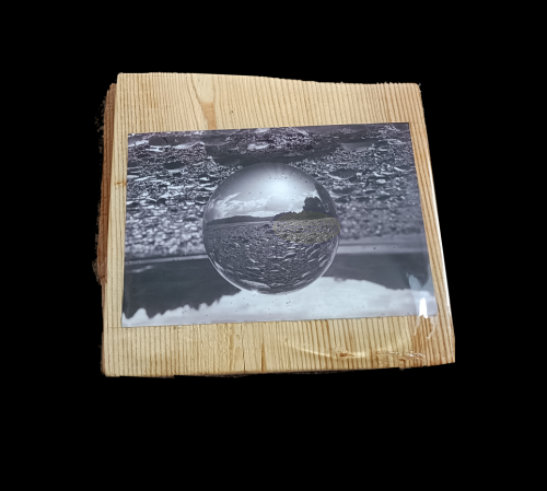 lensball image mounted on an off cut of wood flooring